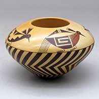 A high shouldered polychrome bowl decorated with a bird design above the shoulder and a geometric design below
 by Garrett Maho of Hopi