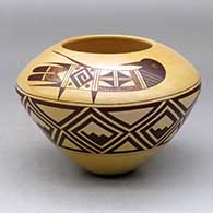A high shouldered polychrome bowl decorated with a bird design above the shoulder and a geometric design below
 by Garrett Maho of Hopi