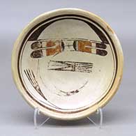 A shallow polychrome bowl decorated with a bird-hanging-from-sky-band and geometric design
 by Nampeyo of Hano of Hopi