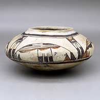 A polychrome seed pot decorated above the shoulder with a four panel bird element and geometric design
 by Nampeyo of Hano of Hopi