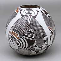 A polychrome jar decorated with a four panel lizard and geometric design
 by Sylvia Naha of Hopi