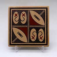 A polychrome tile decorated with a four panel geometric design
 by Stetson Setalla of Hopi