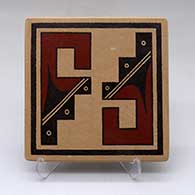 A polychrome tile decorated with a geometric design
 by Stetson Setalla of Hopi