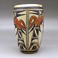A polychrome cylinder decorated with a two panel thunderbird and geometric design, click or tap to see a larger version