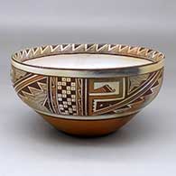 A polychrome bowl decorated on the inside with a black on white katsina design and on the outside with a four panel geometric design and fire clouds, click or tap to see a larger version