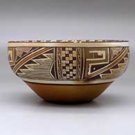 A polychrome bowl decorated on the inside with a black on white katsina design and on the outside with a four panel geometric design and fire clouds, click or tap to see a larger version