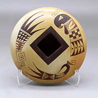A polychrome seed pot with a square opening and decorated above the shoulder with a bird element, bat wing and geometric design
 by Terran Naha of Hopi