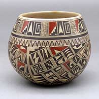 A polychrome bowl polished on the inside and decorated around the outside with a four panel small sherd and geometric design
 by Rondina Huma of Hopi