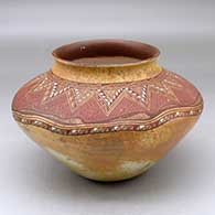 A polychrome high shouldered jar decorated below the shoulder with a splatter pattern and above the shoulder with a fine line and geometric design
 by Nathan Begaye of Hopi