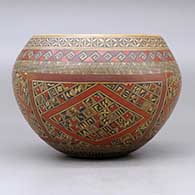 A polychrome bowl polished on the inside and decorated around the outside with a four panel small shard, fineline and geometric design, click or tap to see a larger version