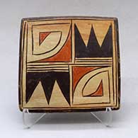 A polychrome tile decorated with a four panel bat wing and geometric design
 by Unknown of Hopi
