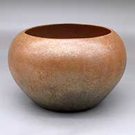 A golden micaceous bowl with fire clouds
 by Tammie Allen of Jicarilla Apache