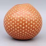 Red bowl with organic opening and sgraffito geometric design, click or tap to see a larger version