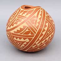 Red bowl with organic opening and sgraffito geometric design
 by Carol Vigil of Jemez