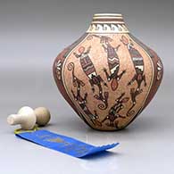 First Place winning jar at the 2011 Gallup InterTribal Ceremonial, lidded and decorated with a four-panel butterfly, corn plant, lizard and geometric design
 by Bonnie Fragua of Jemez