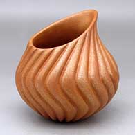 A golden micaceous carved melon jar with an organic opening
 by Gordon Foley of Jemez