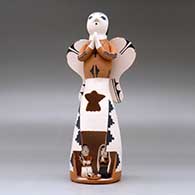 A standing polychrome Singing Angel with a nativity scene inside a cutout in her skirt, click or tap to see a larger version