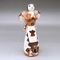A standing polychrome Singing Angel with a nativity scene inside a cutout in her skirt
 by Angel Bailon of Jemez