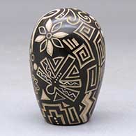 A brown and tan seed pot with a sgraffito and painted geometric design, click or tap to see a larger version