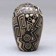 A brown and tan seed pot with a sgraffito and painted geometric design, click or tap to see a larger version