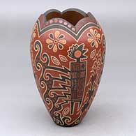 A polychrome vase with a scalloped rim and decorated with a lightly-carved and painted four-panel kachina, flower and geometric design
 by Glendora Fragua of Jemez