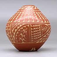 A red seed pot decorated with a sgraffito turtle, corn plant, feather, arrowhead and geometric design, click or tap to see a larger version