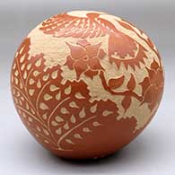 A red seed pot decorated with a sgraffito hummingbird, flower, vine and geometric design, click or tap to see a larger version