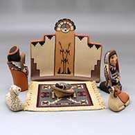 A six-piece Nativity set with a carpet, click or tap to see a larger version