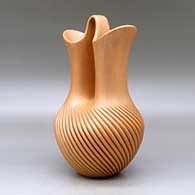 A golden micaceous wedding vase with a swirl carved melon base, click or tap to see a larger version