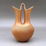 A golden micaceous wedding vase with a swirl carved melon base, click or tap to see a larger version