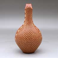 A red wedding vase decorated with a sgraffito four-panel snowflake and geometric design, click or tap to see a larger version