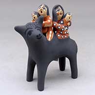 A polychrome figure of a mother, father and two children on the back of a gray horse
 by Felicia Fragua of Jemez