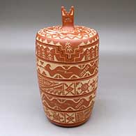 Click for a larger view A lidded red jar with a kiva step cut opening and decorated with a sgraffito avanyu, turtle, corn stalk and geometric design
by Alvina Yepa of Jemez