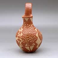 A red wedding vase decorated with a sgraffito hummingbird, butterfly, flower, leaf, branch and geometric design, click or tap to see a larger version