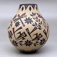 A polychrome jar decorated with a sgraffito and painted dragonfly, flower and geometric design, click or tap to see a larger version