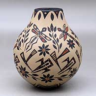 A polychrome jar decorated with a sgraffito and painted dragonfly, flower and geometric design, click or tap to see a larger version