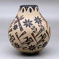 A polychrome jar decorated with a sgraffito and painted dragonfly, flower and geometric design, click or tap to see a larger version