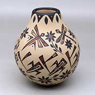 A polychrome jar decorated with a sgraffito and painted dragonfly, flower and geometric design
 by Glendora Fragua of Jemez