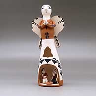 A polychrome Singing Angel figure with a nativity in her skirt, click or tap to see a larger version