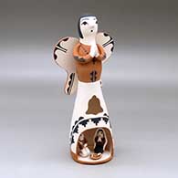 A polychrome Singing Angel figure with a nativity in her skirt
 by Angel Bailon of Jemez