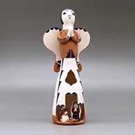 A polychrome Singing Angel figure with a nativity in her skirt, click or tap to see a larger version