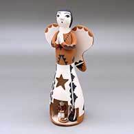 A polychrome Singing Angel figure with a nativity in her skirt
 by Angel Bailon of Jemez