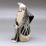 A standing eagle storyteller with four chicks and a blanket, click or tap to see a larger version