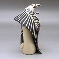 A standing eagle storyteller with four chicks and a blanket, click or tap to see a larger version