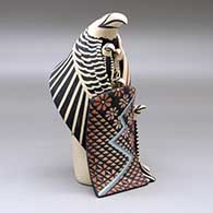 A standing eagle storyteller with four chicks and a blanket, click or tap to see a larger version