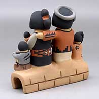 A grandparent storyteller figure with three children, click or tap to see a larger version