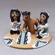 A polychrome single-piece nativity scene with Joseph, Mary, baby and pony
 by Felicia Fragua of Jemez