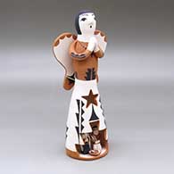 A polychrome Singing Angel figure with a nativity in her skirt
 by Angel Bailon of Jemez