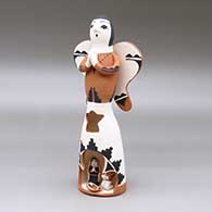 A polychrome Singing Angel figure with a nativity in her skirt
 by Angel Bailon of Jemez