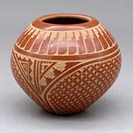 A red on buff jar decorated with a sgraffito snowflake, kiva step, feather and geometric design
 by Wilma Baca Tosa of Jemez